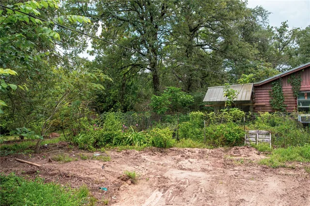 a backyard of a house with lots of green space
