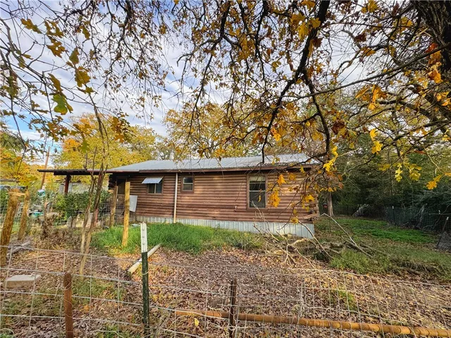 a backyard of a house with lots of green space