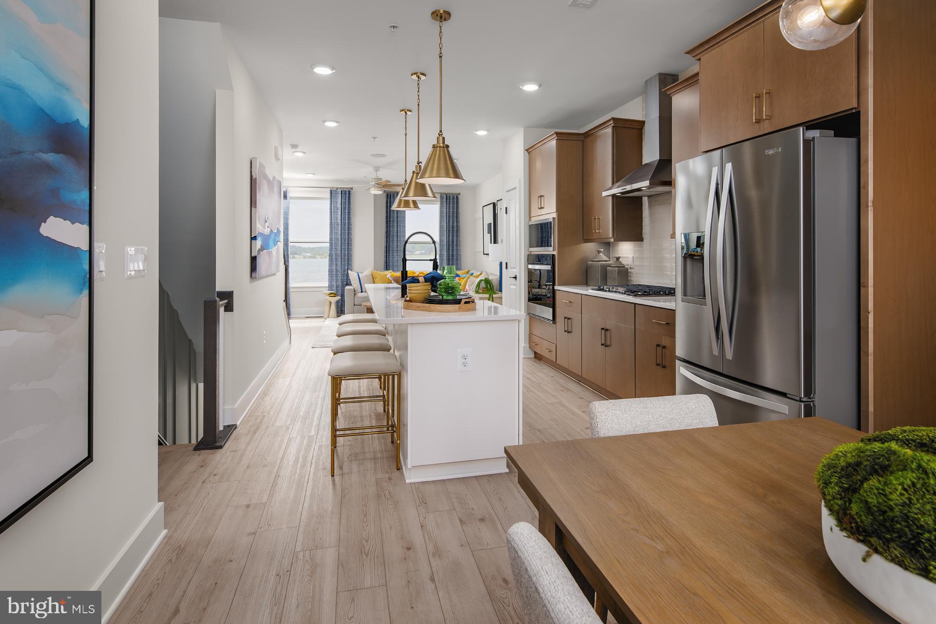 2607 Light Street Baltimore, MD 21230 - Photo 6 of 29 a kitchen with white cabinets and stainless steel appliances