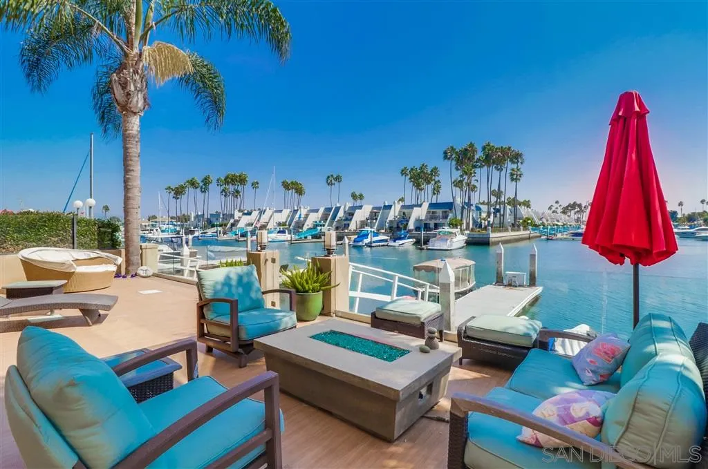 22 Green Turtle Road Coronado, CA 92118 - Photo 12 of 25 a living room with furniture a rug and a table