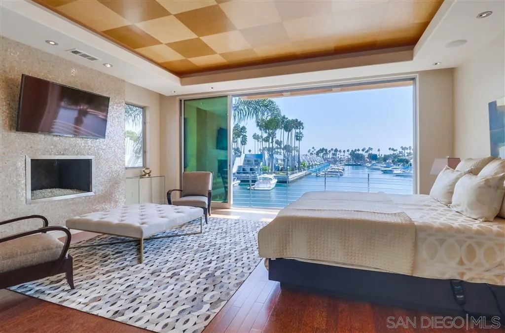 22 Green Turtle Road Coronado, CA 92118 - Photo 14 of 25 a living room with furniture and a flat screen tv