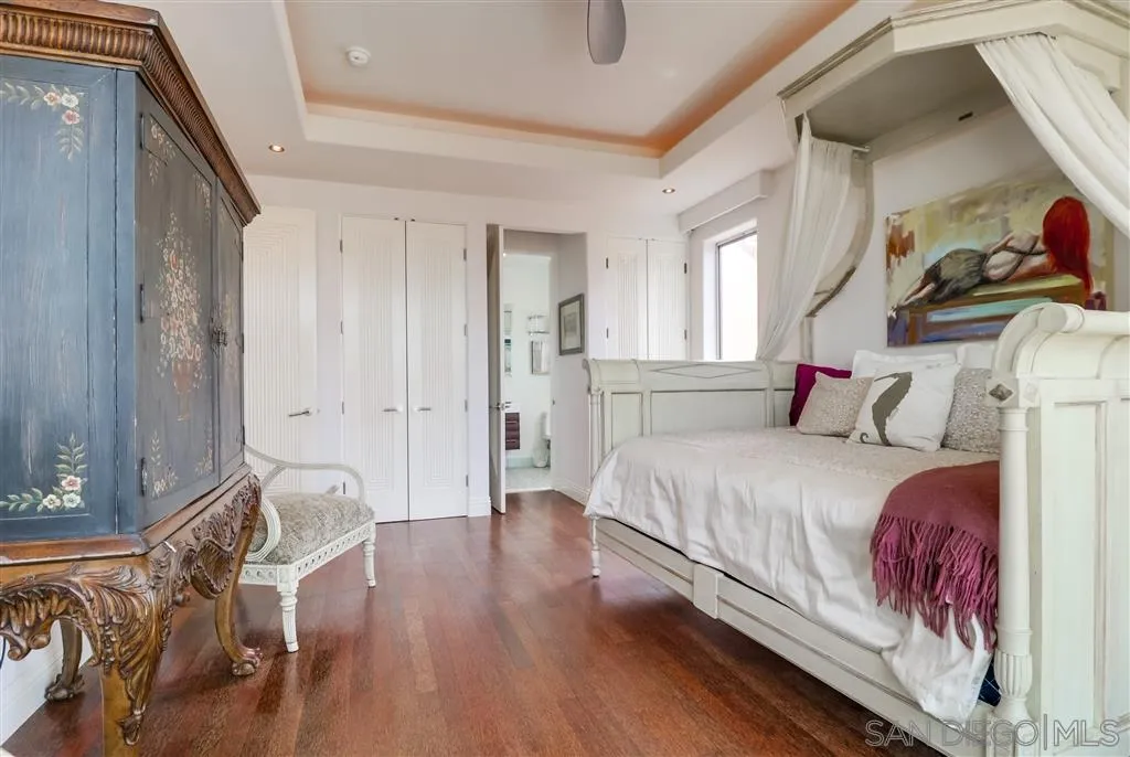 22 Green Turtle Road Coronado, CA 92118 - Photo 20 of 25 a bedroom with furniture and wooden floor