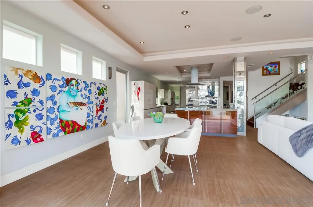 22 Green Turtle Road Coronado, CA 92118 - Photo 6 of 25 a view of a dining room with furniture and wooden floor