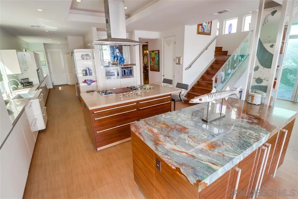22 Green Turtle Road Coronado, CA 92118 - Photo 8 of 25 a living room with lots of furniture and a wooden floor