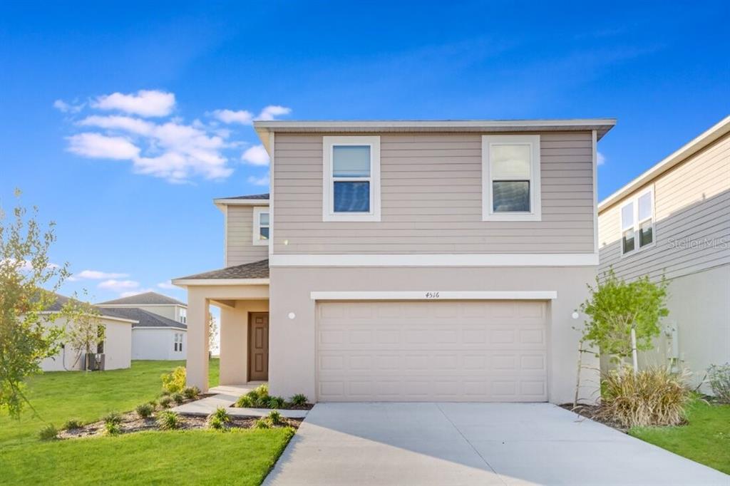 4516 Ranunculus St Lake Haines City, FL 33844 - Photo 1 of 1 a front view of house with yard