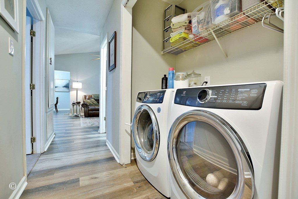 180 Mulberry Lane Fortson, GA 31808 - Photo 13 of 22 a view of a storage and utility room with washer and dryer