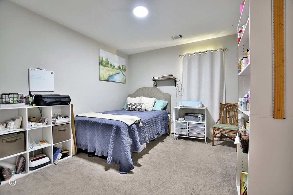 180 Mulberry Lane Fortson, GA 31808 - Photo 17 of 22 a bedroom with a bed furniture and a window