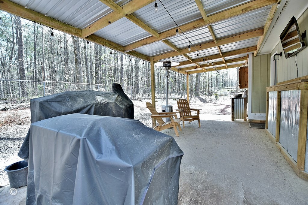 180 Mulberry Lane Fortson, GA 31808 - Photo 18 of 22 a living room with furniture and a flat screen tv
