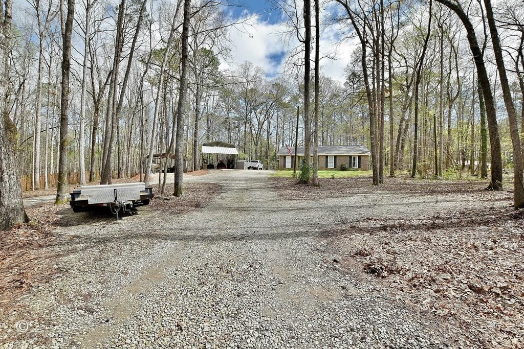 180 Mulberry Lane Fortson, GA 31808 - Photo 2 of 22 a view of a outdoor space with trees