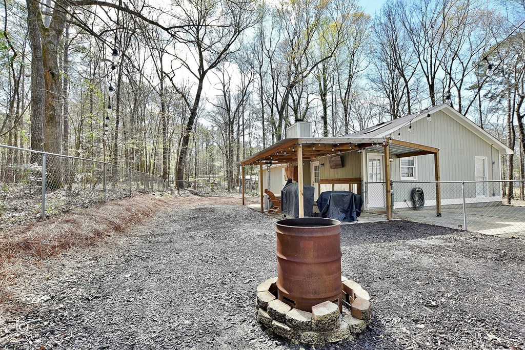 180 Mulberry Lane Fortson, GA 31808 - Photo 21 of 22 a front view of a house with garden