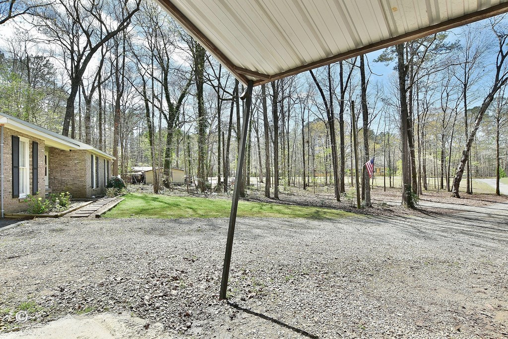 180 Mulberry Lane Fortson, GA 31808 - Photo 22 of 22 a backyard of a house with lots of green space