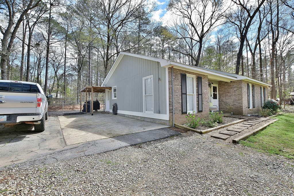 180 Mulberry Lane Fortson, GA 31808 - Photo 4 of 22 a view of a house with a yard covered in snow