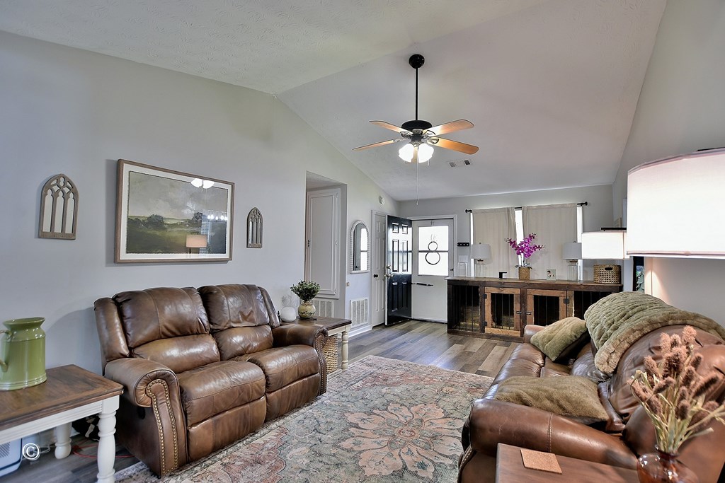 180 Mulberry Lane Fortson, GA 31808 - Photo 5 of 22 a living room with furniture and a chandelier