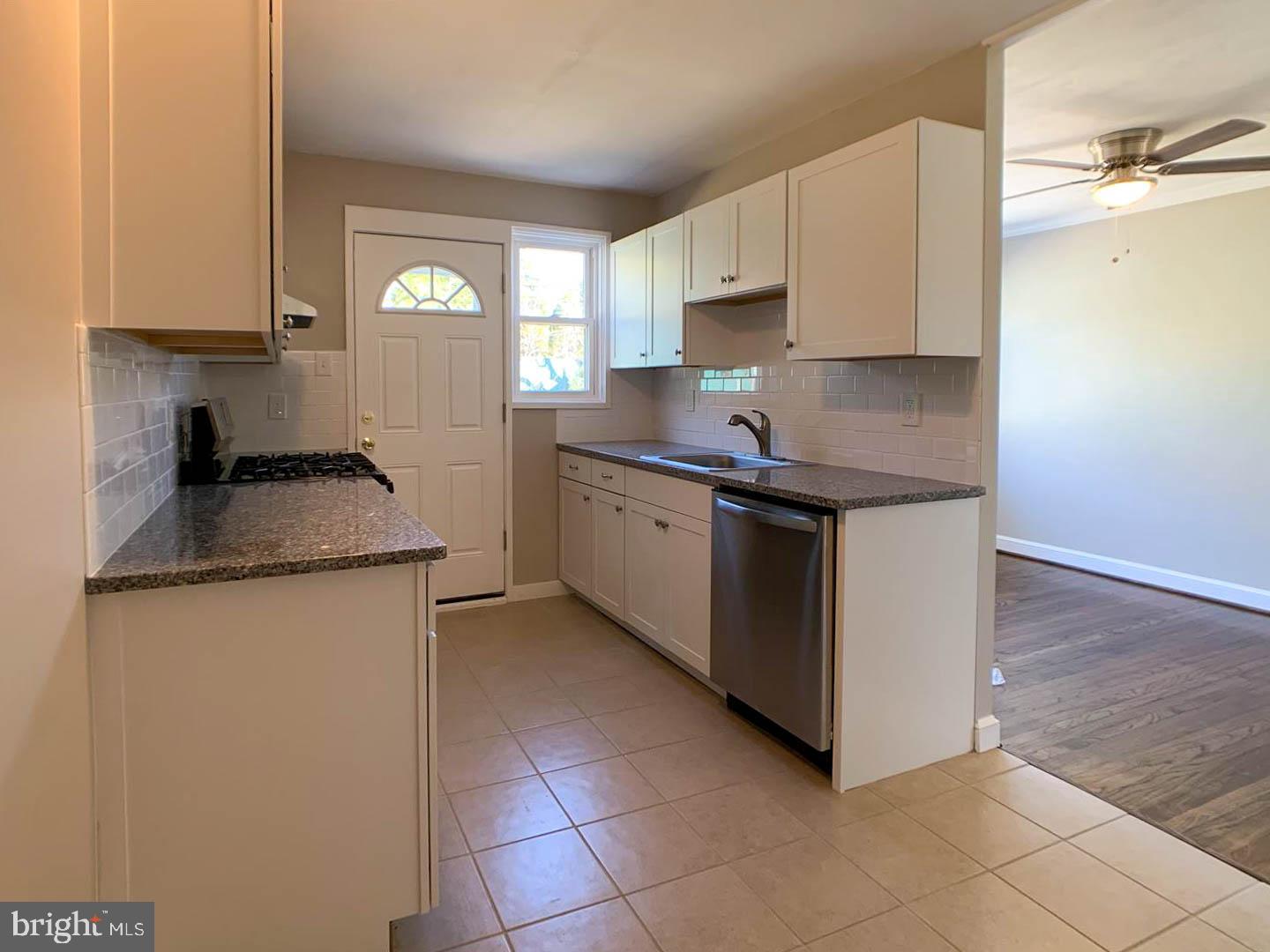 1567 Parklane Road Swarthmore, PA 19081 - Photo 4 of 23 a kitchen with granite countertop a sink and a stove