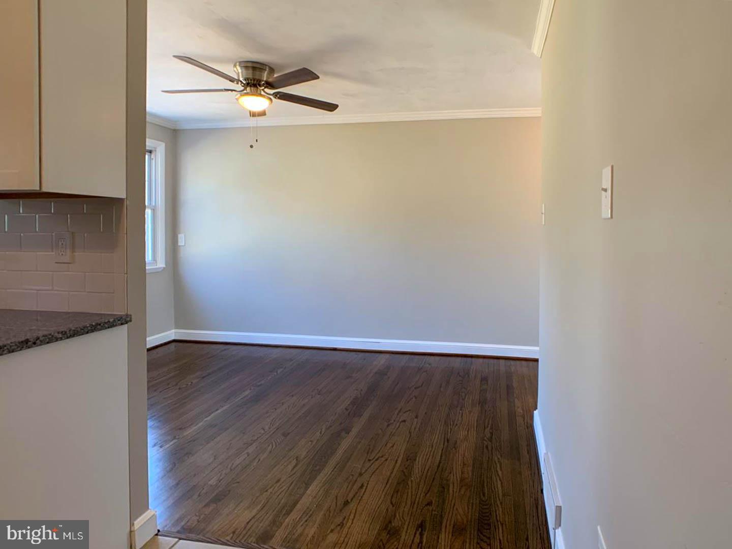 1567 Parklane Road Swarthmore, PA 19081 - Photo 7 of 23 a view of an empty room with wooden floor