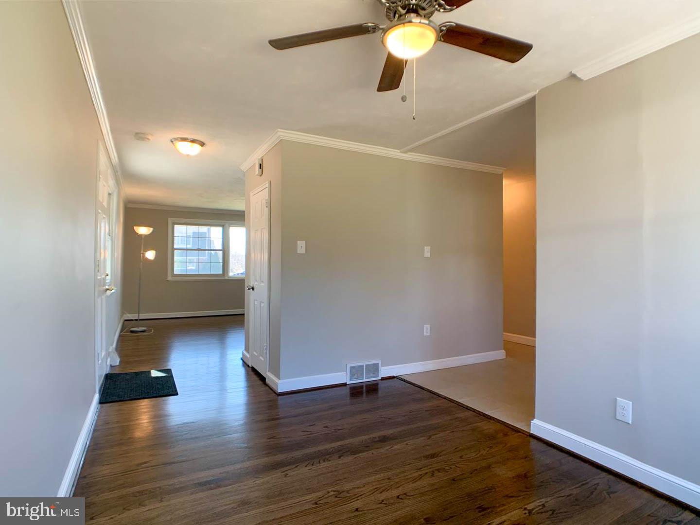 1567 Parklane Road Swarthmore, PA 19081 - Photo 9 of 23 wooden floor in an empty room with a window