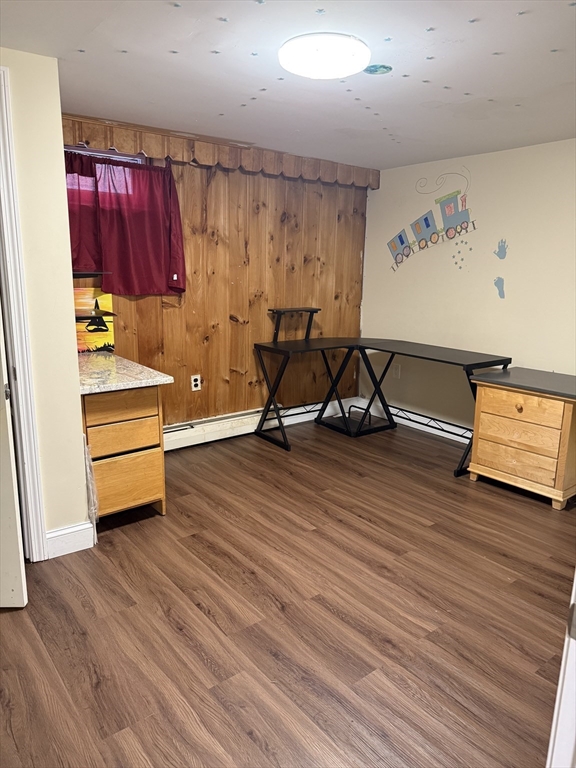 77 Roland Road Revere, MA 02151 - Photo 11 of 18 a view of a room with wooden floor and furniture