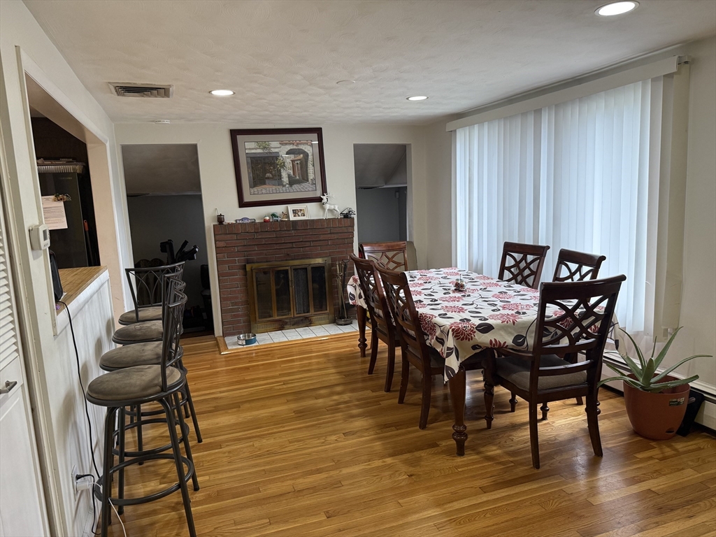 77 Roland Road Revere, MA 02151 - Photo 17 of 18 a view of a dining room with furniture window and wooden floor