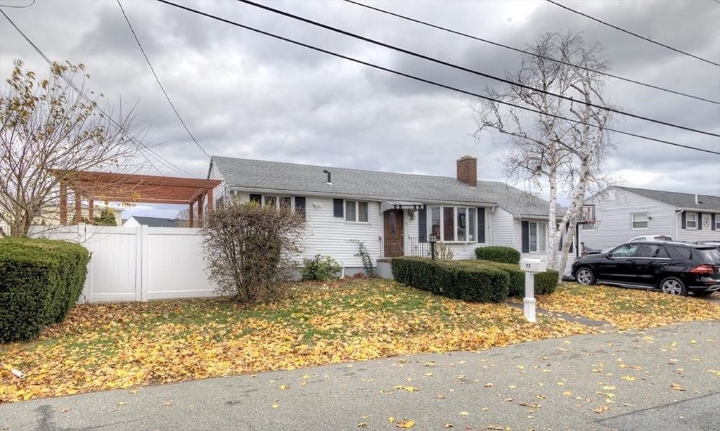 77 Roland Road Revere, MA 02151 - Photo 2 of 18 a front view of a house with a yard
