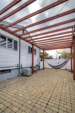 a view of a chairs and table in the patio