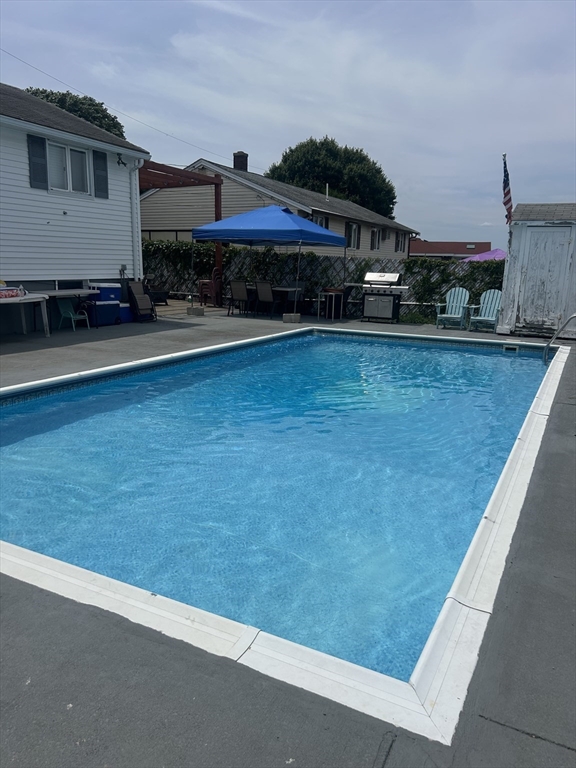 77 Roland Road Revere, MA 02151 - Photo 5 of 13 a view of a big house with a big yard