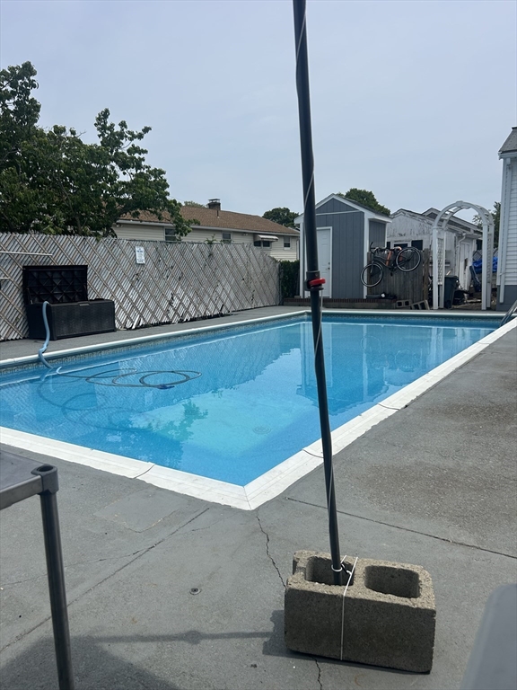 77 Roland Road Revere, MA 02151 - Photo 7 of 18 a view of swimming pool with a chair