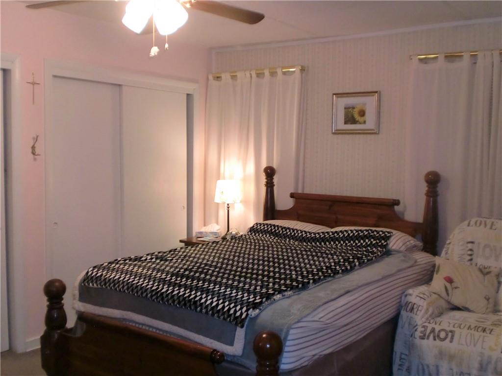 230 43rd Street Pittsburgh, PA 15201 - Photo 11 of 19 a bedroom with a bed and a window