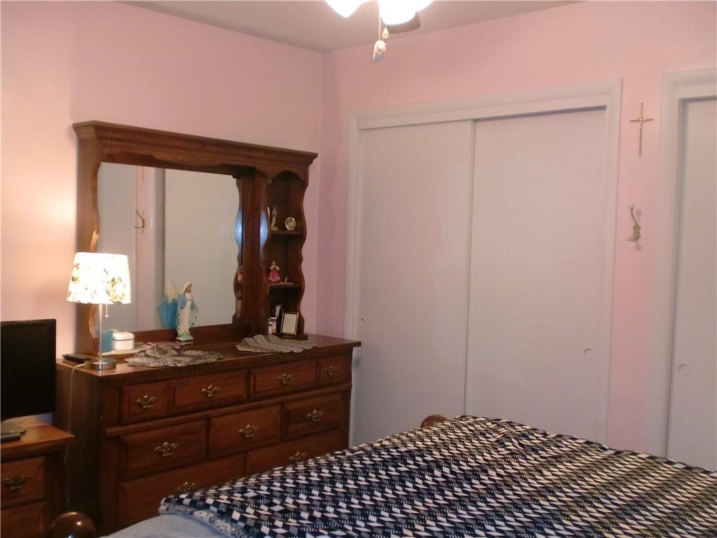 230 43rd Street Pittsburgh, PA 15201 - Photo 12 of 19 a bedroom with a bed and a mirror