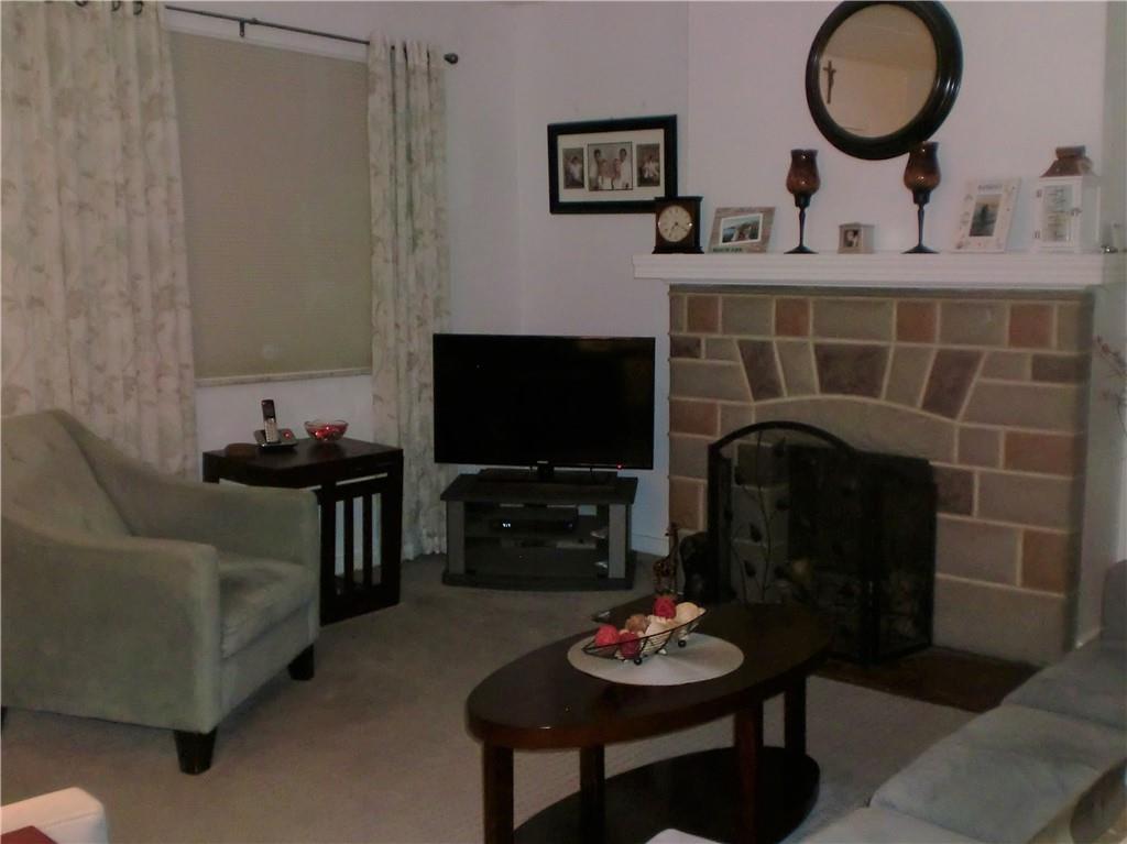 230 43rd Street Pittsburgh, PA 15201 - Photo 2 of 19 a living room with furniture and a fireplace