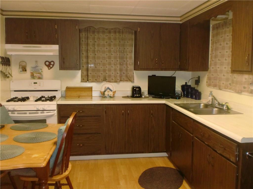230 43rd Street Pittsburgh, PA 15201 - Photo 7 of 19 a kitchen with a sink cabinets and appliances