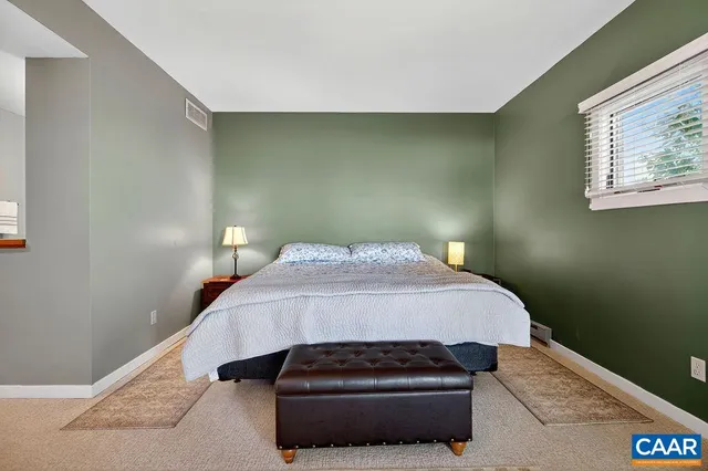 a room with a bed and tv