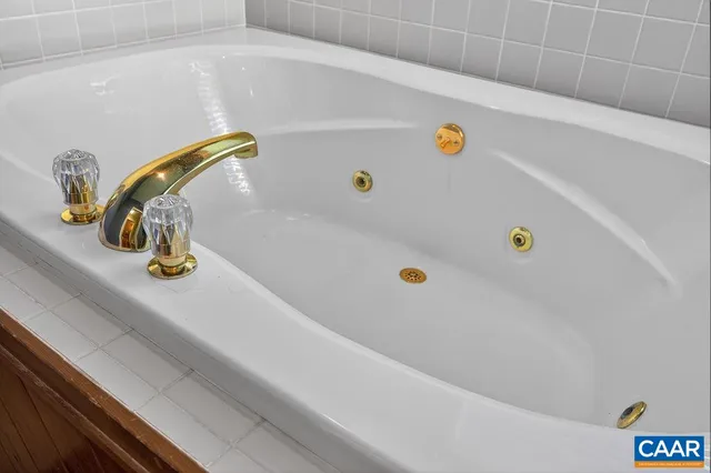 a bedroom with bed and wooden floor