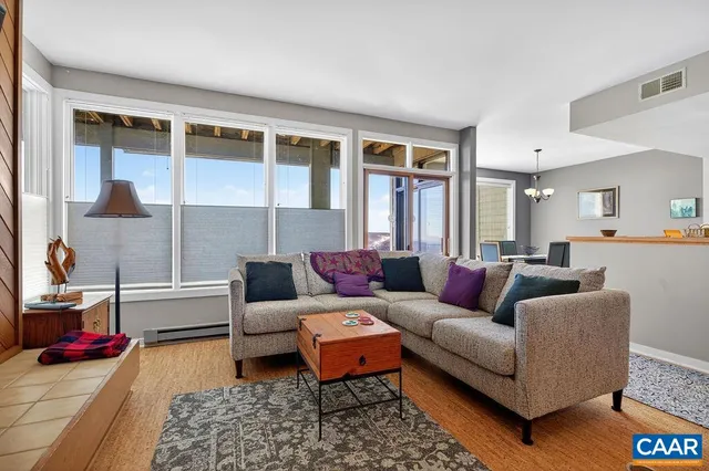 a living room with furniture and a table