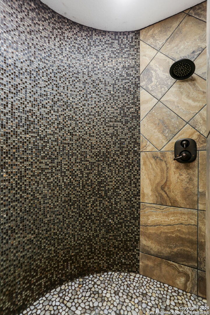 303 Schneider Street Poth, TX 78147 - Photo 26 of 41 a bathroom with a shower