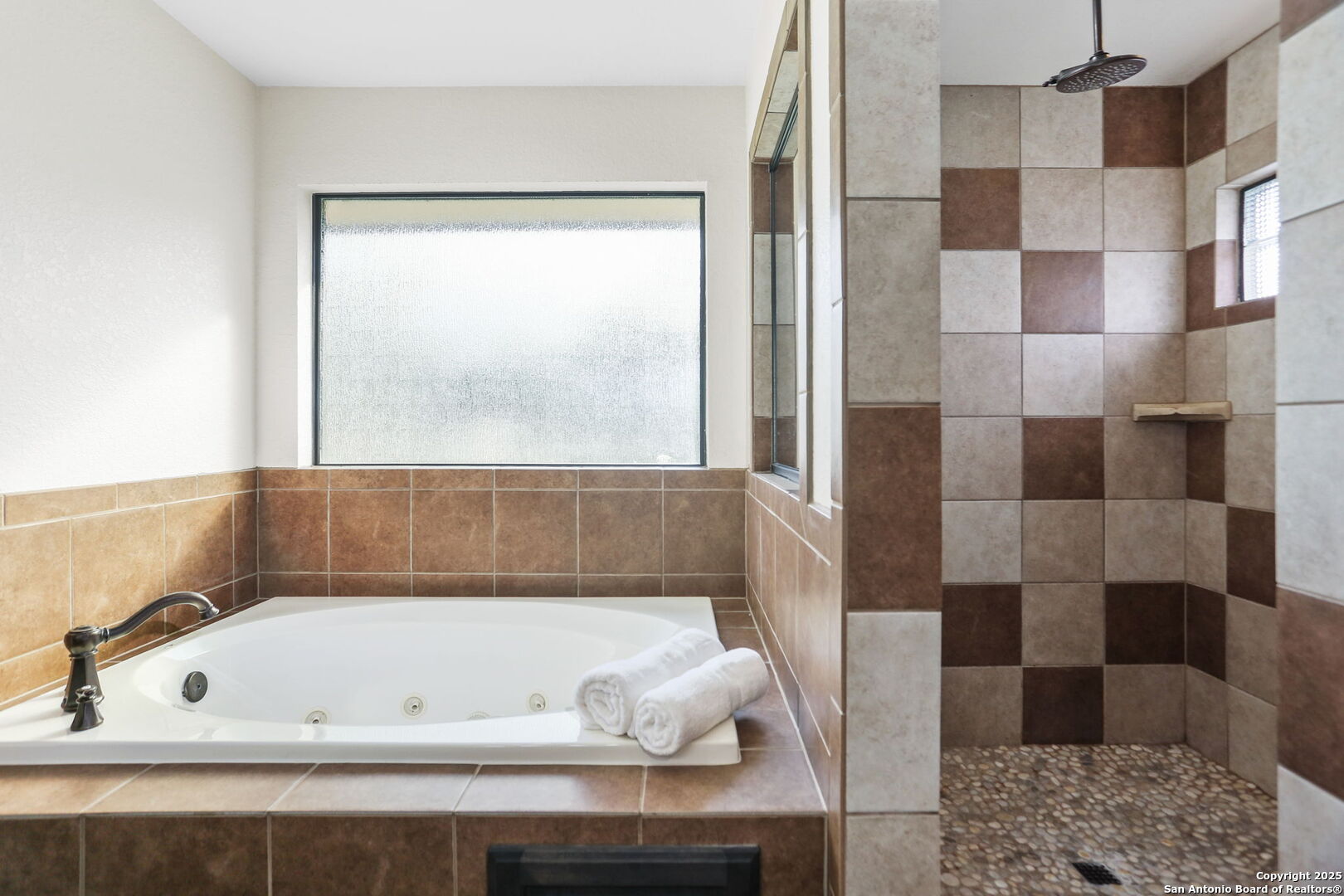 303 Schneider Street Poth, TX 78147 - Photo 30 of 41 a bathroom with a bathtub and a shower