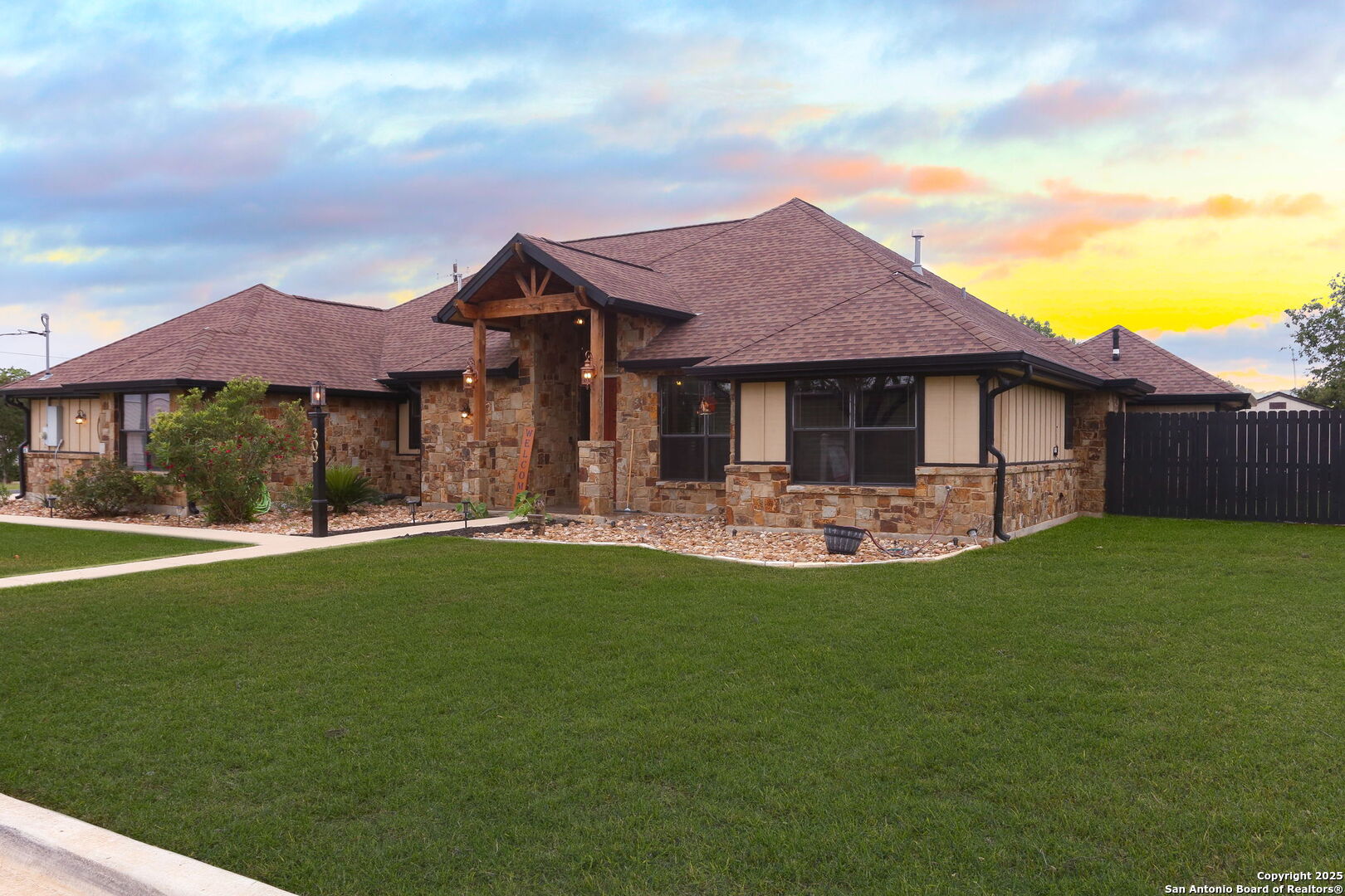 303 Schneider Street Poth, TX 78147 - Photo 5 of 41 a front view of house with yard barbeque and outdoor seating