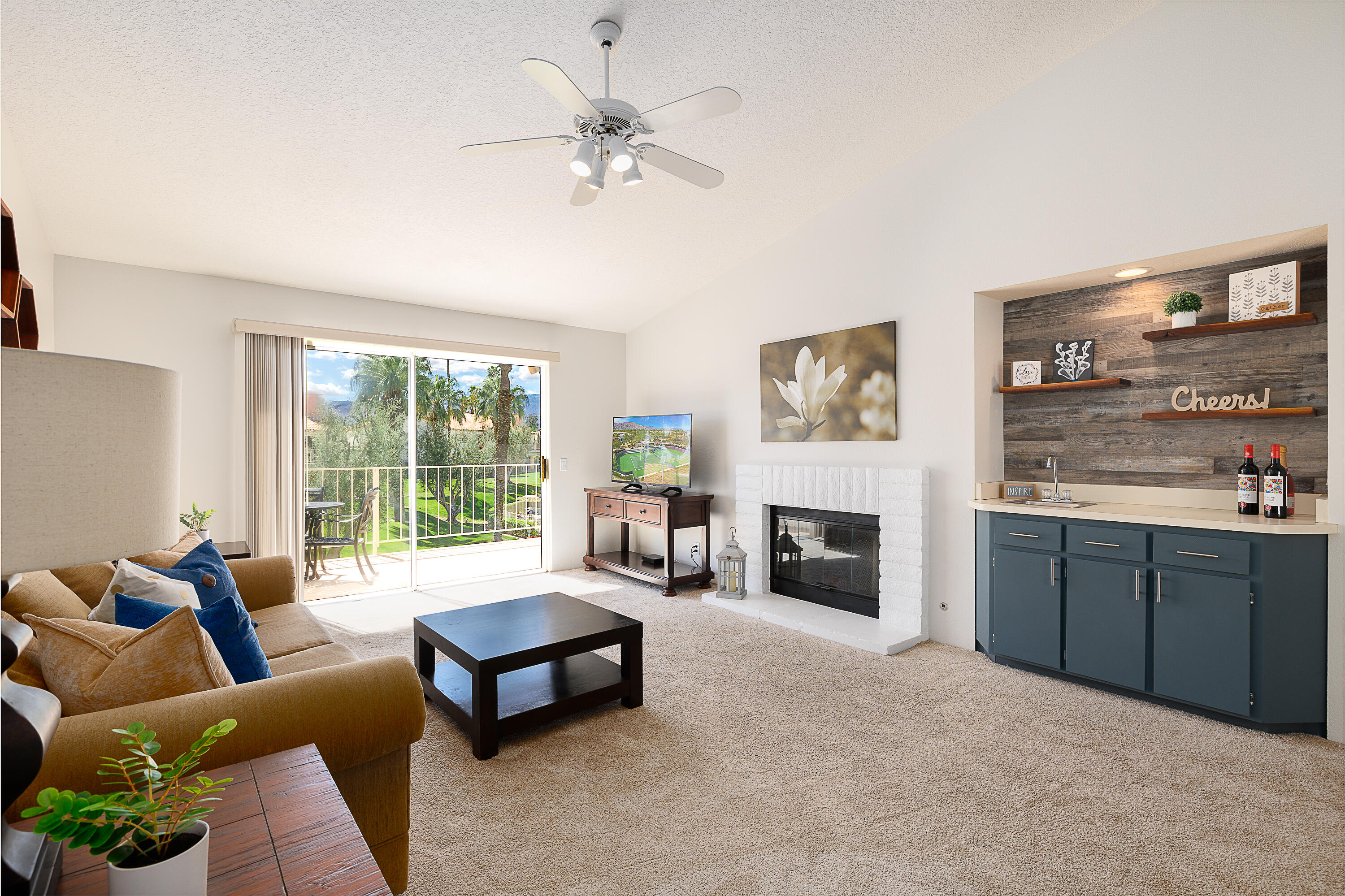 175 Firestone Drive Palm Desert, CA 92211 - Photo 1 of 24 a living room with furniture and fireplace