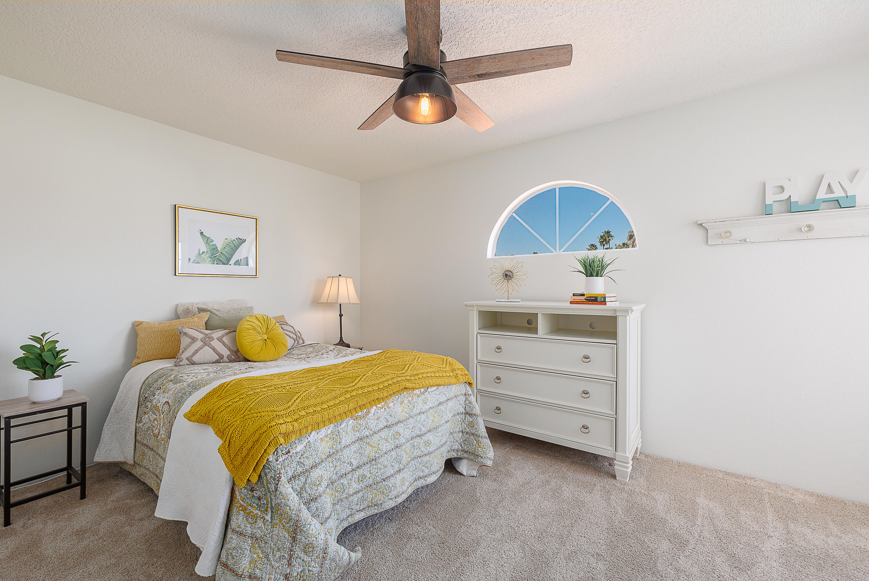 175 Firestone Drive Palm Desert, CA 92211 - Photo 12 of 24 a bedroom with a bed and a ceiling fan