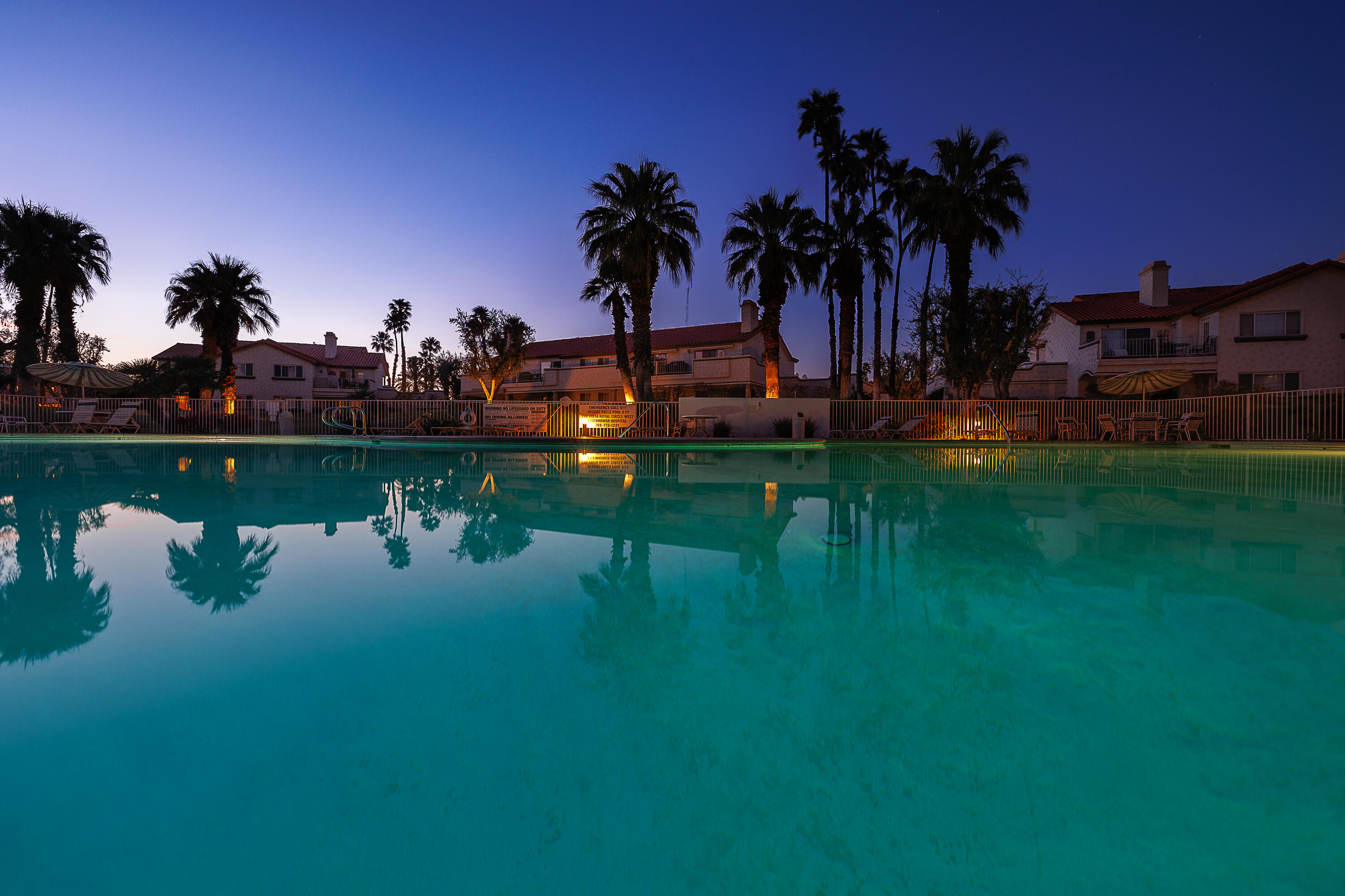 175 Firestone Drive Palm Desert, CA 92211 - Photo 20 of 24 a view of a lake with a palm tree