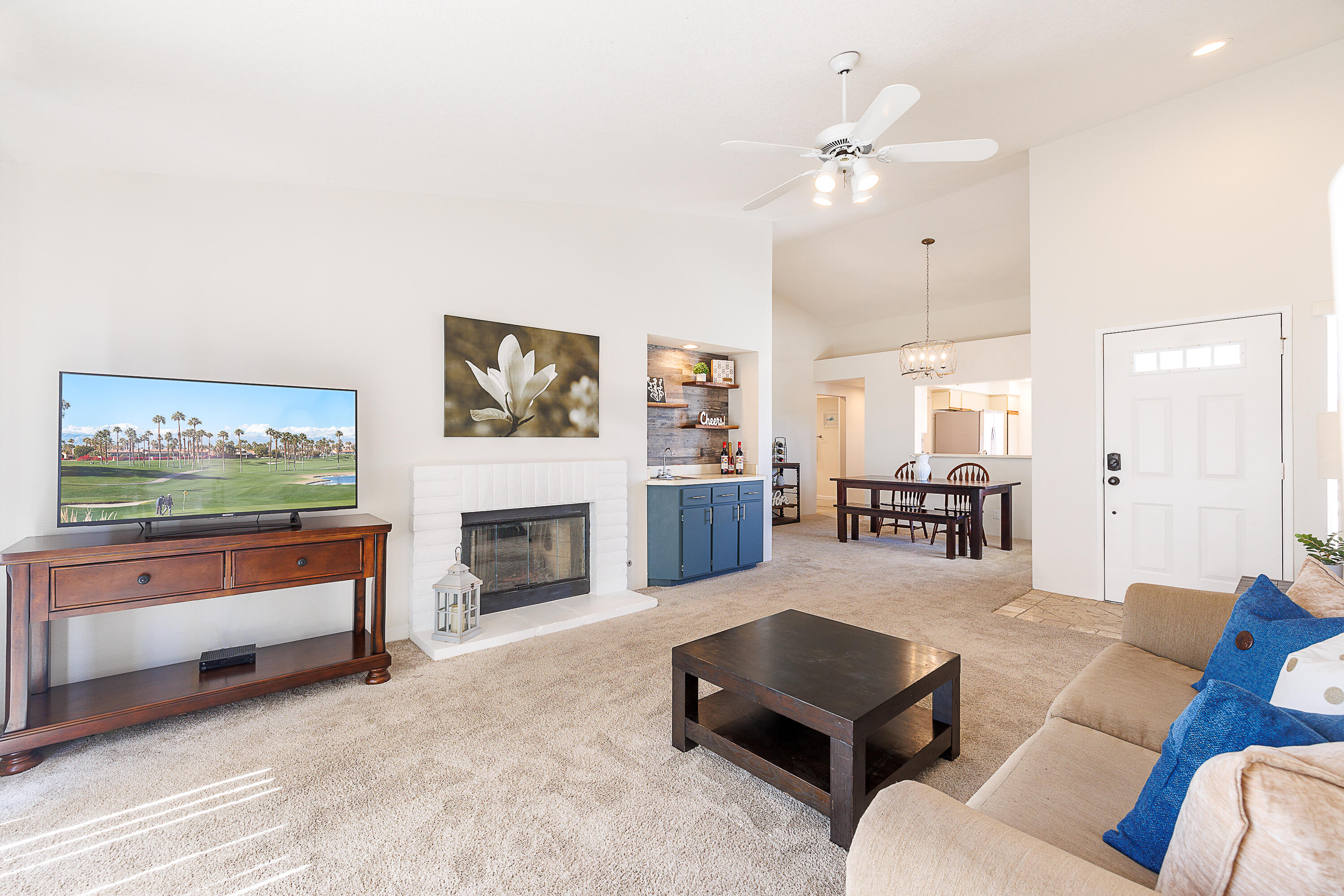 175 Firestone Drive Palm Desert, CA 92211 - Photo 3 of 24 a living room with furniture and a fireplace