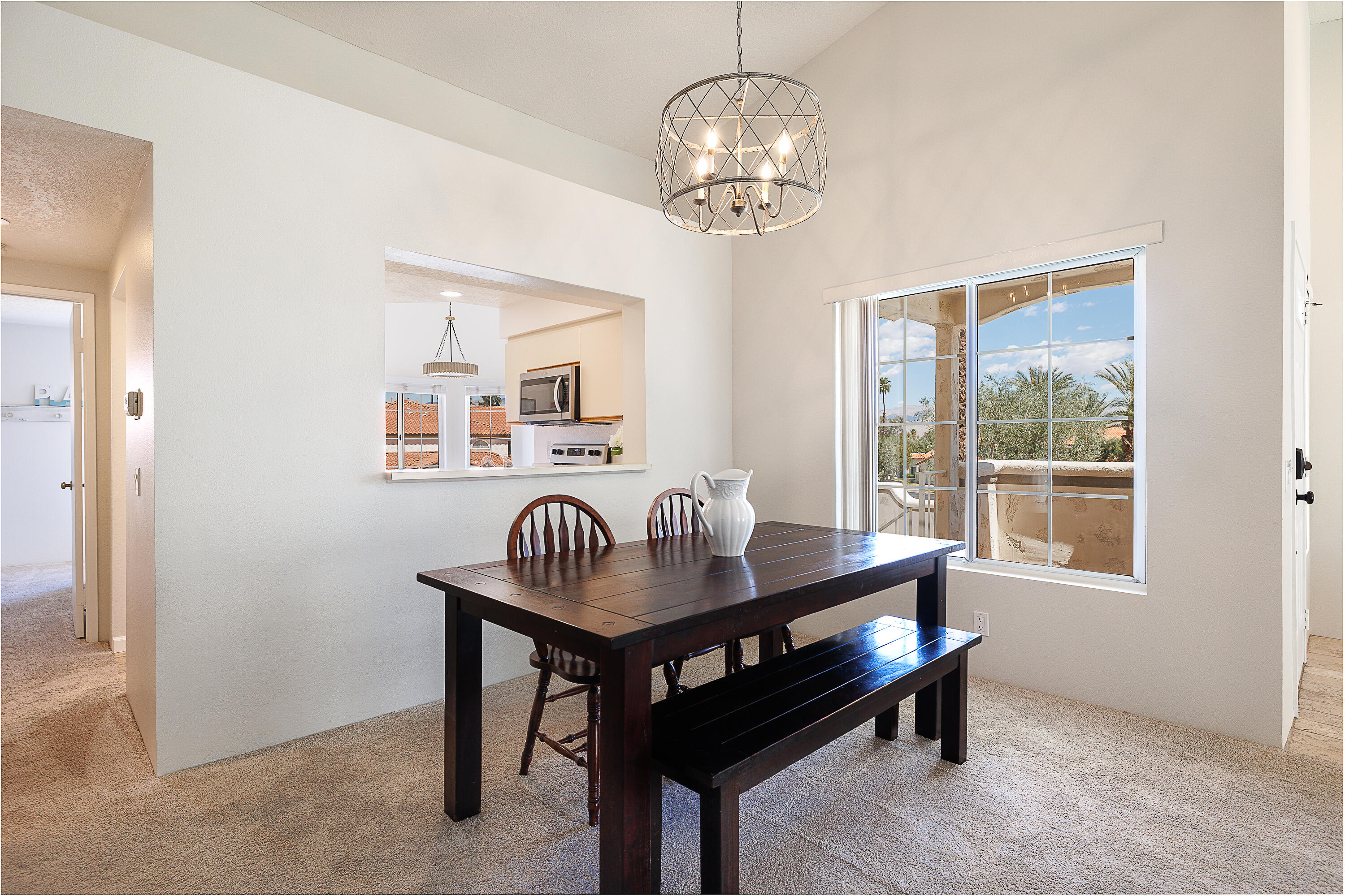 175 Firestone Drive Palm Desert, CA 92211 - Photo 5 of 24 a room with wooden table and windows