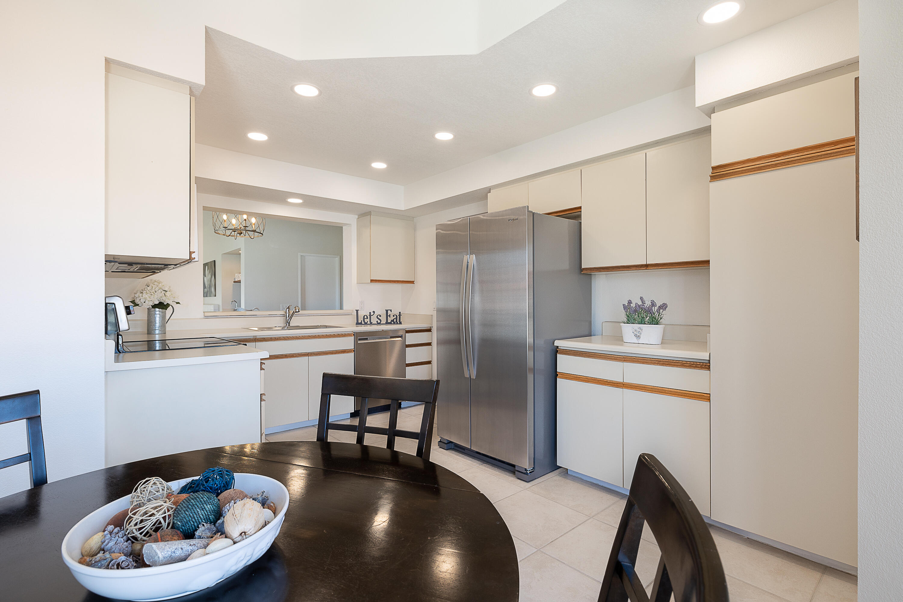 175 Firestone Drive Palm Desert, CA 92211 - Photo 8 of 24 a kitchen with stainless steel appliances granite countertop a sink a stove a refrigerator and cabinets