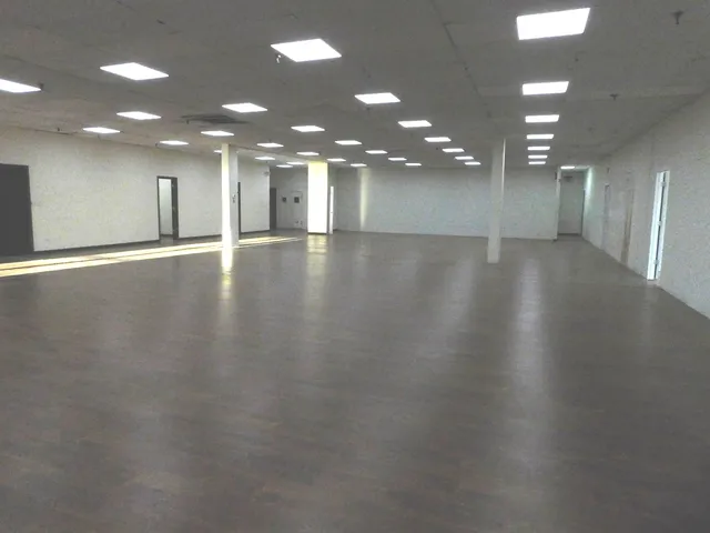 an empty room with wooden floor