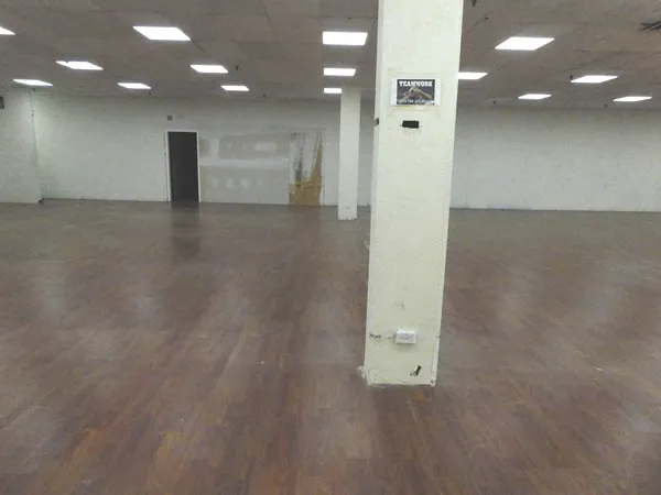 an empty room with a bench