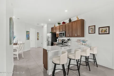 a kitchen that has a sink cabinets counter space and stainless steel appliances