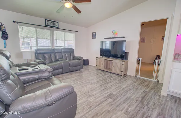 a kitchen with kitchen island a sink a stove and wooden floor