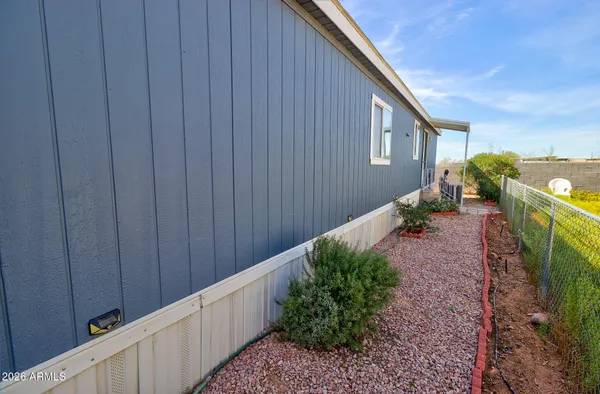 a couple of potted plants in front of a house