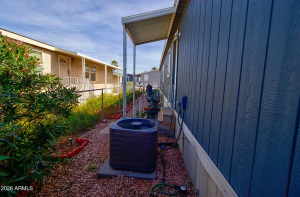 a view of a house with backyard and swimming pool