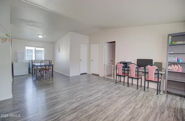 a view of a livingroom with furniture and windows