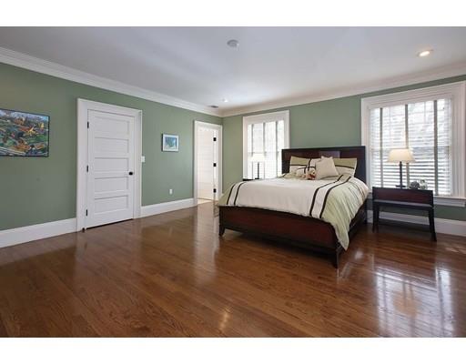 33 Kingsbury Road Newton, MA 02467 - Photo 12 of 23 a spacious bedroom with a bed and wooden floor